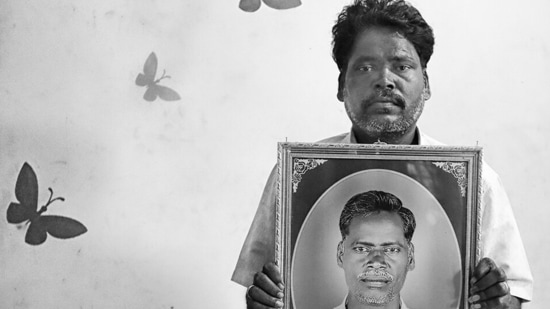 Ramesh Sundaram holds up an image of his late brother Kalyan Sundaram. Also from The First Witnesses. Jodha says his photography is a reflection of his legacy, a reference to the famine research conducted by his late father, agricultural economist NS Jodha, and referenced in books by economists such as Amartya Sen and Jean Drèze.(Photo: Vijay S Jodha)