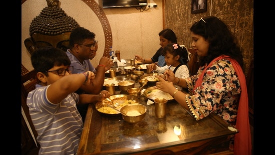 Foodies from all over Delhi-NCR are trying authentic Bengali dishes in CR Park, as food stalls and bhog at Durga Puja pandals remain subjected to COVID restrictions this year as well. (Photo: Raajessh Kashyap/HT) Foodies from all over Delhi-NCR are trying authentic Bengali dishes in CR Park, as food stalls and bhog at Durga Puja pandals remain subjected to COVID restrictions this year as well. (Photo: Raajessh Kashyap/HT)