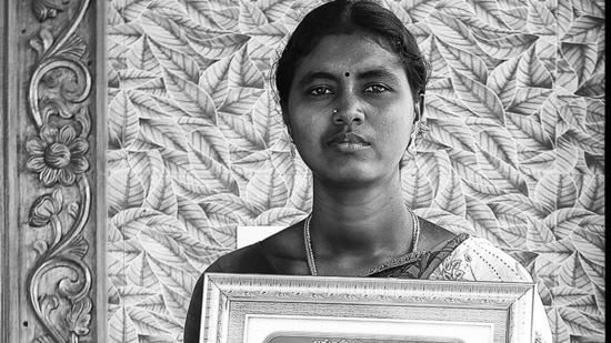 Vasanthi with an image of her late father. As the marginalised Indian farmer’s indebtedness and vulnerability to the vagaries of the monsoon are exacerbated by a growing climate crisis, Jodha says he wants to break fresh ground on the issue.(Photo: Vijay S Jodha )
