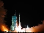 The crewed spaceship Shenzhou-13, atop a Long March-2F carrier rocket being launched from the Jiuquan Satellite Launch Center in northwest China's Gobi Desert,(Xinhua news agency via AP) The crewed spaceship Shenzhou-13, atop a Long March-2F carrier rocket being launched from the Jiuquan Satellite Launch Center in northwest China's Gobi Desert,(Xinhua news agency via AP)