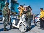 A soldier frisks a motorist along a street in Srinagar on Friday.( AFP) A soldier frisks a motorist along a street in Srinagar on Friday.( AFP)