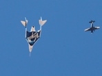Virgin Galactic's passenger rocket plane VSS Unity, carrying billionaire entrepreneur Richard Branson and his crew, descends after reaching the edge of space above Spaceport America near Truth or Consequences, New Mexico, US