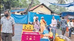 People adhere to Covid-appropriate behaviour at a fish market in Kochi, Kerala on October 6. (AP) People adhere to Covid-appropriate behaviour at a fish market in Kochi, Kerala on October 6. (AP)
