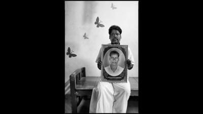 Ramesh Sundaram holds up an image of his late brother Kalyan Sundaram. Also from The First Witnesses. Jodha says his photography is a reflection of his legacy, a reference to the famine research conducted by his late father, agricultural economist NS Jodha, and referenced in books by economists such as Amartya Sen and Jean Drèze. (Photo: Vijay S Jodha) Ramesh Sundaram holds up an image of his late brother Kalyan Sundaram. Also from The First Witnesses. Jodha says his photography is a reflection of his legacy, a reference to the famine research conducted by his late father, agricultural economist NS Jodha, and referenced in books by economists such as Amartya Sen and Jean Drèze. (Photo: Vijay S Jodha)