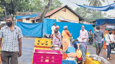 People adhere to Covid-appropriate behaviour at a fish market in Kochi, Kerala on October 6. (AP) People adhere to Covid-appropriate behaviour at a fish market in Kochi, Kerala on October 6. (AP)