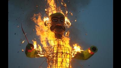 An effigy of Ravana burning at Parade Ground, Sector 17, Chandigarh, where organisers used an audio recording of bursting firecrackers instead. (Ravi Kumar/HT) An effigy of Ravana burning at Parade Ground, Sector 17, Chandigarh, where organisers used an audio recording of bursting firecrackers instead. (Ravi Kumar/HT)