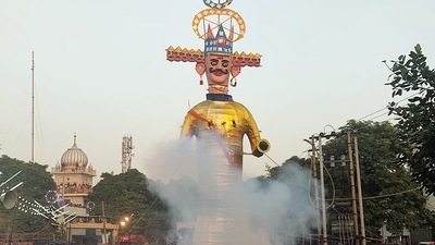 Effigy of Ravana in flames during Dussehra celebration, at Civil Lines, in Ludhiana on Friday. (ANI Photo)