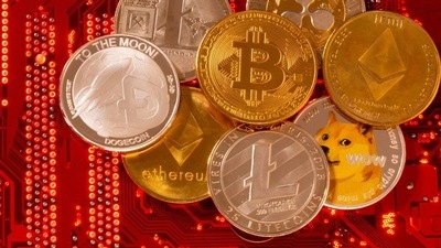 FILE PHOTO: Representations of cryptocurrencies Bitcoin, Ethereum, DogeCoin, Ripple, Litecoin are placed on PC motherboard in this illustration taken, June 29, 2021. REUTERS/Dado Ruvic/Illustration/File Photo (REUTERS)