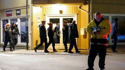 Police work at the scene where an arrow was shot into a wall in Kongsberg, Norway, Wednesday, Oct. 13, 2021.&nbsp; (AP)