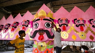 Artists busy in making an effigy of Raavan ahead of the Dussehra festival.; (PTI) Artists busy in making an effigy of Raavan ahead of the Dussehra festival.; (PTI)