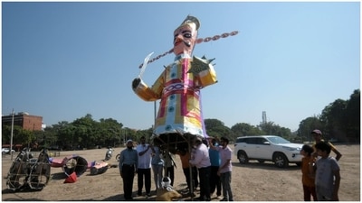 Devotees help in installing the effigies. (HT Photos/ Ravi Kumar) Devotees help in installing the effigies. (HT Photos/ Ravi Kumar)