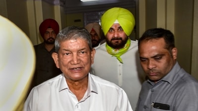 Punjab Pradesh Congress Committee chief Navjot Singh Sidhu with Congress's Punjab in-charge Harish Rawat after a meeting in New Delhi. (PTI)