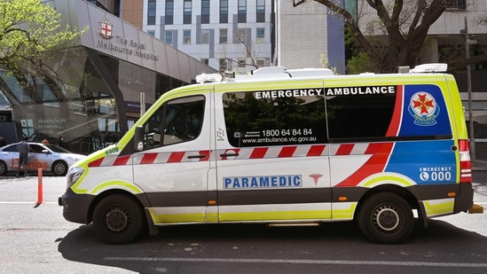 An ambulance drives past the Royal Melbourne Hospital in Melbourne (AFP)