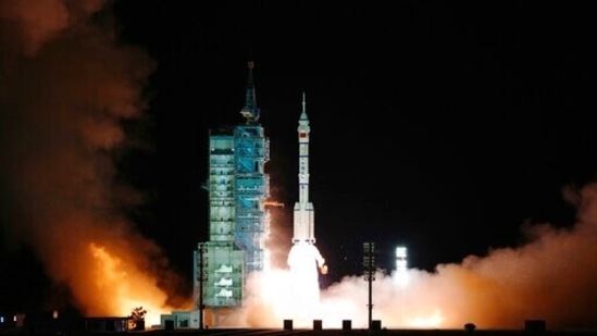 The crewed spaceship Shenzhou-13, atop a Long March-2F carrier rocket being launched from the Jiuquan Satellite Launch Center in northwest China's Gobi Desert,(Xinhua news agency via AP)