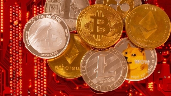 FILE PHOTO: Representations of cryptocurrencies Bitcoin, Ethereum, DogeCoin, Ripple, Litecoin are placed on PC motherboard in this illustration taken, June 29, 2021. REUTERS/Dado Ruvic/Illustration/File Photo(REUTERS)