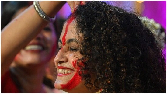 With sindoor khela, the countdown for next year's Durga Puja starts.(AFP)