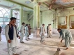 Afghan men inspect the damages inside a Shiite mosque in Kandahar Afghan men inspect the damages inside a Shiite mosque in Kandahar 