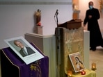 An image of murdered British Conservative lawmaker David Amess is displayed near the altar in St Peters Catholic Church before a vigil in Leigh-on-Sea on Friday.(AP Photo) An image of murdered British Conservative lawmaker David Amess is displayed near the altar in St Peters Catholic Church before a vigil in Leigh-on-Sea on Friday.(AP Photo)
