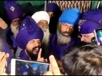 A group of Nihangs address the mediapersons shortly before Saravjeet Singh, who claimed responsibility for lynching of a man at Singhu border, surrendered to the police.