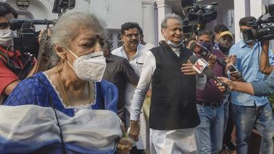 Rajasthan Chief Minister Ashok Gehlot and Congress leader Ambika Soni leave after attending Congress Working Committee meeting at AICC HQ in New Delhi on Saturday. (PTI PHOTO.) Rajasthan Chief Minister Ashok Gehlot and Congress leader Ambika Soni leave after attending Congress Working Committee meeting at AICC HQ in New Delhi on Saturday. (PTI PHOTO.)