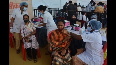 Beneficiaries get jabbed at the Anand Vihar centre in Kalwa on Saturday, when the Thane Municipal Corporation conducted a mass vaccination drive against Covid. (PRAFUL GANGURDE/HT PHOTO) Beneficiaries get jabbed at the Anand Vihar centre in Kalwa on Saturday, when the Thane Municipal Corporation conducted a mass vaccination drive against Covid. (PRAFUL GANGURDE/HT PHOTO)
