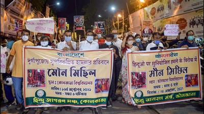 Members of Hindu Jagran Manch participate in a candlelight rally against the alleged attack on the ISKCON temple at Bangladesh. (PTI PHOTO.) Members of Hindu Jagran Manch participate in a candlelight rally against the alleged attack on the ISKCON temple at Bangladesh. (PTI PHOTO.)