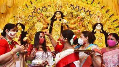 Married women apply vermillion (Sindur) on each other as part of 'Sindur Khela' ritual on the last day of the Durga Puja festival, in Kolkata. (ANI) Married women apply vermillion (Sindur) on each other as part of 'Sindur Khela' ritual on the last day of the Durga Puja festival, in Kolkata. (ANI)