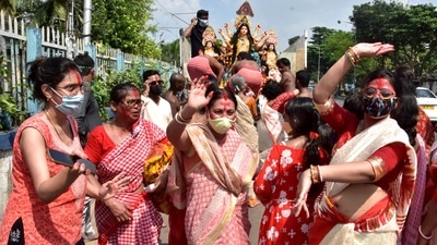 Women in red sarees participate in an immersion procession dance on the last day of Durga Puja festival in Kolkata. (ANI) Women in red sarees participate in an immersion procession dance on the last day of Durga Puja festival in Kolkata. (ANI)