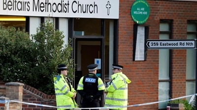 Police officers stand guard at the scene of the fatal stabbing of Conservative British lawmaker David Amess, at Belfairs Methodist Church in Leigh-on-Sea, a district of Southend-on-Sea, in southeast England on October 16, 2021.&nbsp; (Photo by Tolga Akmen / AFP)