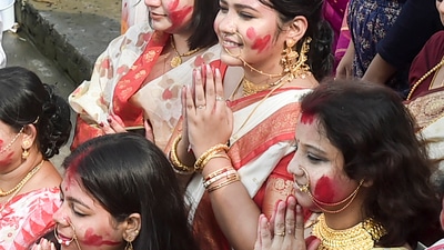 Married women offer prayers during immersion of the idol of Goddess Durga at the bank of river Ganga in Kolkata. (PTI) Married women offer prayers during immersion of the idol of Goddess Durga at the bank of river Ganga in Kolkata. (PTI)