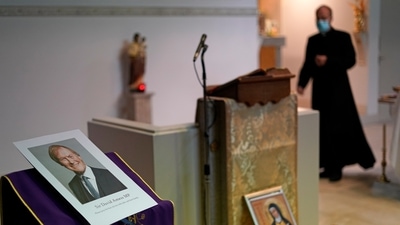 An image of murdered British Conservative lawmaker David Amess is displayed near the altar in St Peters Catholic Church before a vigil in Leigh-on-Sea on Friday. (AP Photo)