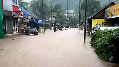 Flood water gushes through low-lying areas triggered by heavy incessant rain at Ranni, in Pathanamthitta on Saturday. (ANI PHOTO.) Flood water gushes through low-lying areas triggered by heavy incessant rain at Ranni, in Pathanamthitta on Saturday. (ANI PHOTO.)