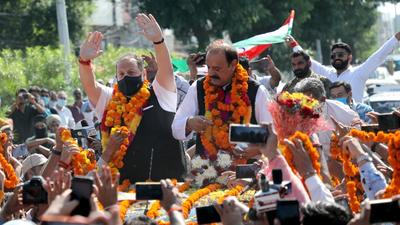 Former Jammu and Kashmir National Conference leaders Devender Rana and Surjit Slathia receive a warm welcome by supporters after joining BJP, in Jammu on Saturday. (Shanky Rathore)