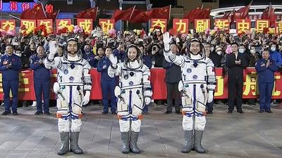 This screen grab by Chinese state broadcaster CCTV shows astronauts Ye Guangfu, Wang Yaping and Zhai Zhigang, the second crew for China's new space station, waving at a departure ceremony before their launch on the Shenzhou 13 spacecraft, at the Jiuquan Satellite Launch Centre in the Gobi desert in northwest China. (AFP PHOTO.) This screen grab by Chinese state broadcaster CCTV shows astronauts Ye Guangfu, Wang Yaping and Zhai Zhigang, the second crew for China's new space station, waving at a departure ceremony before their launch on the Shenzhou 13 spacecraft, at the Jiuquan Satellite Launch Centre in the Gobi desert in northwest China. (AFP PHOTO.)