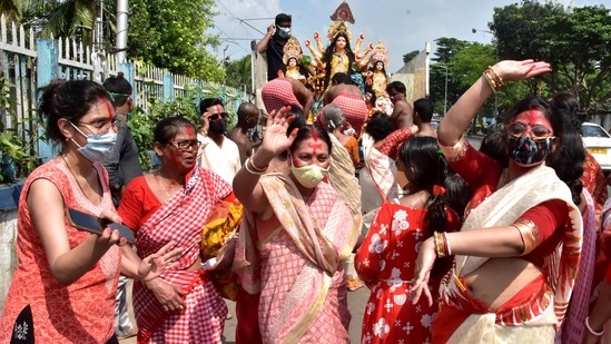 Women in red sarees participate in an immersion procession dance on the last day of Durga Puja festival in Kolkata.&nbsp;(ANI)