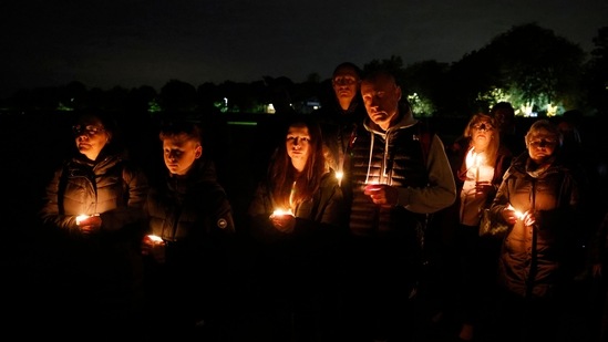 Well-wishers attend a candle-lit vigil in memory of the Conservative British lawmaker David Amess, who was fatally stabbed the previous day, in Leigh-on-Sea, a district of Southend-on-Sea, in southeast England on October 16, 2021.&nbsp;(AFP)