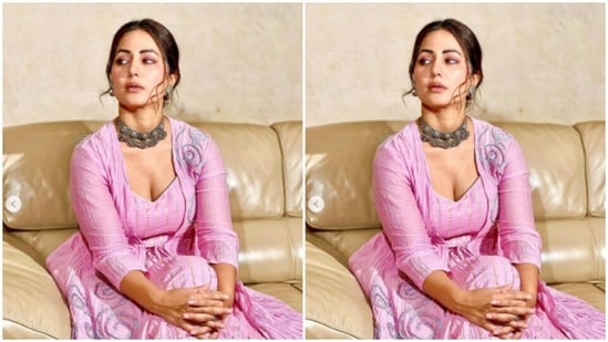 In the pink traditional attire, Hina posed for multiple pictures on a couch.(Instagram/@realhinakhan)