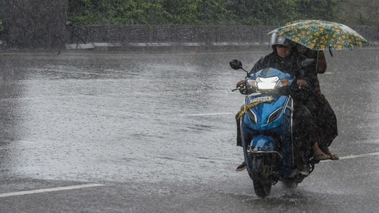 Several districts of Kerala have been put on alert, while the IMD has forecasted heavy rain for 16 other states and UTs. (Photo by NOAH SEELAM/AFP)