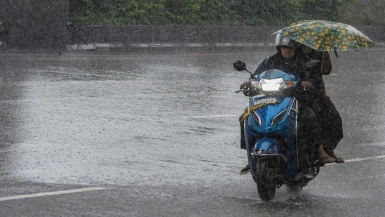 Several districts of Kerala have been put on alert, while the IMD has forecasted heavy rain for 16 other states and UTs. (Photo by NOAH SEELAM/AFP)