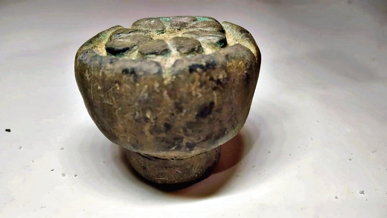 A terracotta seal with a lotus motif. The artefacts found in the region suggest that the ancient town had a bustling trade, wealthy merchants and extensive connections with distant lands. A terracotta seal with a lotus motif. The artefacts found in the region suggest that the ancient town had a bustling trade, wealthy merchants and extensive connections with distant lands.