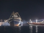 A fishing boat with migrants docked at the port of the Sicilian island of Lampedusa, southern Italy, late Monday.(Sea-Watch.org/David Lohmueller via AP) A fishing boat with migrants docked at the port of the Sicilian island of Lampedusa, southern Italy, late Monday.(Sea-Watch.org/David Lohmueller via AP)