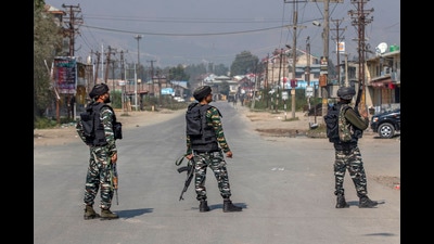 Soldiers stand guard on a road leading towards the site of a gunfight in Kashmir (AP) Soldiers stand guard on a road leading towards the site of a gunfight in Kashmir (AP)