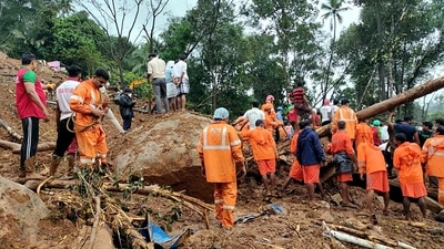 NDRF personnel clear debris caused by a landslide during search and rescue operations at a flood-affected area, at Kokkayar, in Idukki on October 17. (ANI ) NDRF personnel clear debris caused by a landslide during search and rescue operations at a flood-affected area, at Kokkayar, in Idukki on October 17. (ANI )
