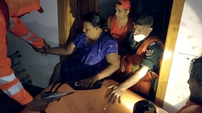 NDRF personnel take out a woman during a search and rescue operation at a flood-affected area, at Ranni, in Pathanamthitta, Kerala on October 17. (ANI ) NDRF personnel take out a woman during a search and rescue operation at a flood-affected area, at Ranni, in Pathanamthitta, Kerala on October 17. (ANI )