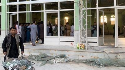 People view the damage inside of a mosque following a suicide bombers attack in the city of Kandahar, southwest Afghanistan (AP)