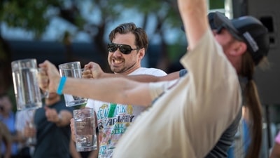 People struggle to hold up steins filled with water during a stein holding contest at the Vegan Oktoberfest beer festival in Los Angeles on October 16. (AFP) People struggle to hold up steins filled with water during a stein holding contest at the Vegan Oktoberfest beer festival in Los Angeles on October 16. (AFP)