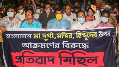 West Bengal BJP workers during a protest rally against the alleged attack on an ISKCON temple in Bangladesh, at Balurghat in South Dinajpur district on Sunday. (PTI PHOTO.) West Bengal BJP workers during a protest rally against the alleged attack on an ISKCON temple in Bangladesh, at Balurghat in South Dinajpur district on Sunday. (PTI PHOTO.)