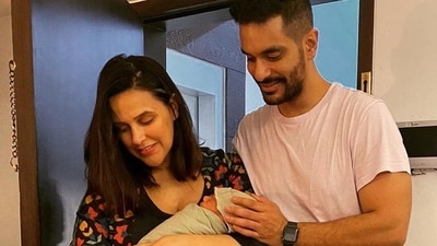 Neha Dhupia and Angad Bedi with their newborn son. Neha Dhupia and Angad Bedi with their newborn son. 