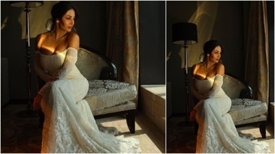 Malaika Arora looked like the perfect bride in this cold-shoulder white body-hugging bridal dress. (Instagram/@malaikaaroraofficial) Malaika Arora looked like the perfect bride in this cold-shoulder white body-hugging bridal dress. (Instagram/@malaikaaroraofficial)