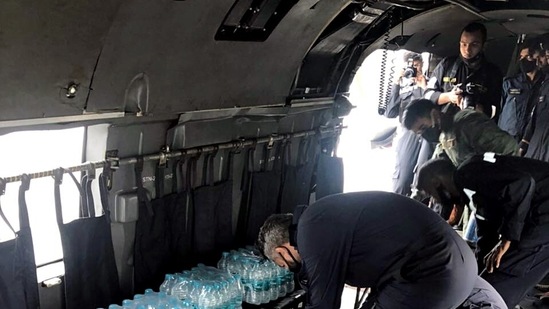 Kochi Southern Naval Command (SNC) personnel on their way to provide relief material to the landslide affected areas, at Koottickal, in Kottayam on October 17.(ANI )